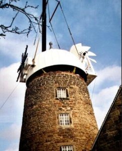 The cap being lowered into position at Heage Tower Mill
