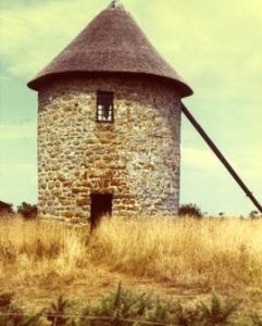 Preserved (sails, and apparently windshaft, missing) tower mill, Brittany, France, summer 1970