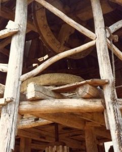 Derelict smock mill near Gaeiras, Portugal, July or August 1981: detail of machinery showing compass