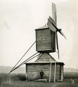 Chicken-hawk museum mill with a man outside in Kuortane, South Bothnia