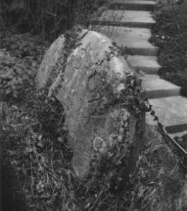 Millstone in garden, Kingston Mill, Lewes
