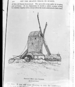Photograph of page of book with line drawing of post mill in working order