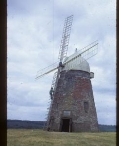 Halnaker Mill, Boxgrove, preserved with sails (man working on one)