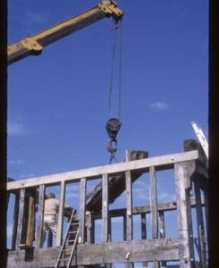Man working on reconstruction of buck, Danzey Green Mill, Avoncroft Museum