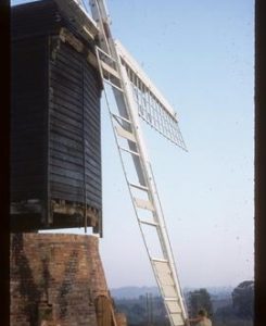 Man fitting shutters to sail, Danzey Green Mill, Avoncroft Museum