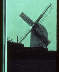 Oldland Mill, Keymer, in working order; portable steam engine with chimney nearby
