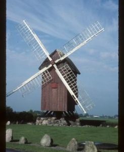 Preserved open-trestle post mill with sails