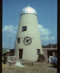 House-converted tower mill with replica ogee cap