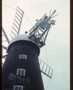 Looking up from ground at cap, sails and fan, Pocklington's Mill, Heckington