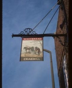 Inn sign "Crab Mill" depicting horse-driven edge runner stone for crushing apples for cider