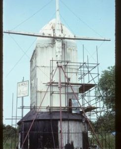 Jill Mill, Clayton, scaffolded for repair, with stocks