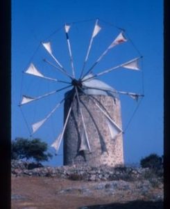 Tower mill, apparently still in use, with conical cap and 12 jib sails