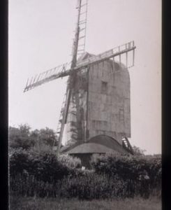Post mill, Playden, derelict, with sails
