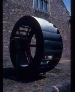 Iron waterwheel mounted as show piece