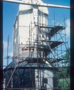 Jill Mill, Clayton, with stocks, scaffolded for repair