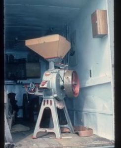 Bamfords grinder in back of van (unidentified location)