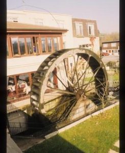 Hotel with waterwheel in grounds