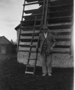Miller Mr Jupp and part of a spring sail, Outwood Post Mill, Outwood