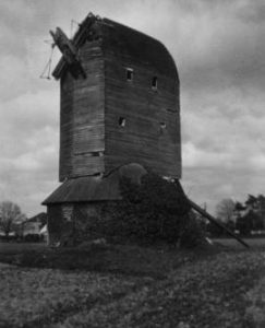 Ivy-clad derelict structure, post mill, Lowfield Heath