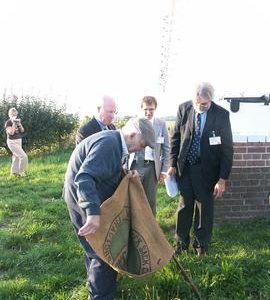 KCC officials and Mr Nelson Doody with sack, post mill, Chillenden