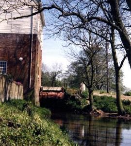 Evegate Mill, Smeeth, and wheel, looking upstream