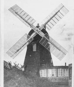 Climping Smock Mill, Climping, hexagonal, black, four common sails, finial
