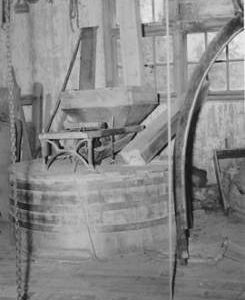 Brewhurst Mill, Loxwood, internal, stone floor with crane