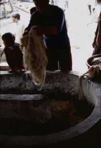 China. Schiqao. Putting fibre in heater mulberry.