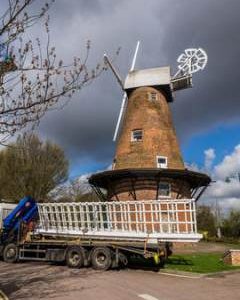 Truck with new sails backing into position in front of Rayleigh Windmill