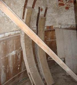 Sections of old curb stored on bin floor, Hickling Mill, Hickling