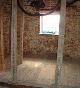 Governor and iron ceiling support columns, tower mill, Moulton, Lincolnshire