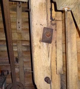 Left rear corner post showing gunstock head, post mill, Nutley