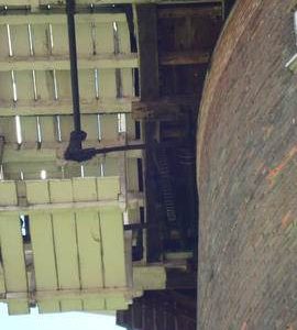 Looking up at fanstage, striking and winding gear, tower mill, Old Buckenham