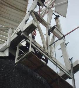 Looking up at cap, fantail, fan gearing and rocking lever, tower mill, Over