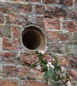 Mystery opening (possibly for a pipe of some kind) in tower wall, tower mill, Upper Dean