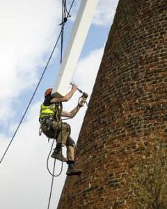 Millwright hammering bolt into sail stock of Rayleigh Windmill