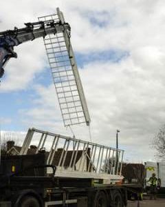 Crane lifting the first sail, Rayleigh Windmill