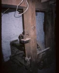 Unidentified item of gearing, partly hidden by supporting column