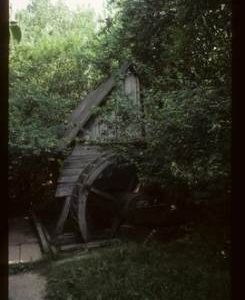 Exterior view of preserved watermill with wheel