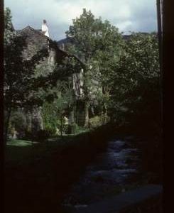 Exterior of Ambleside Mill by stream