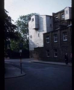 Exterior of part brick, part white-weatherboarded watermill building