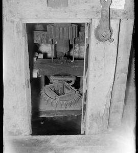 Interior view of water mill showing gearing