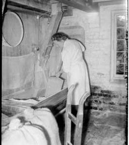 Interior view with miller loading hopper, Dean's Mill, Lindfield