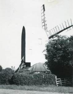 Post mill, Playden, behind trees