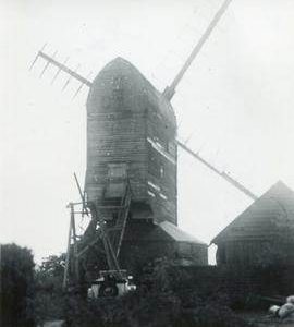 Post mill, Aythorpe Roding, with car