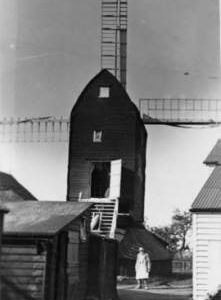 Mount Ephraim Mill, Ash, with sheds and man wearing an apron