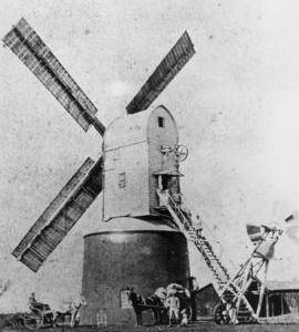 New Mill, Badingham, in working order with carts and millers posed beside