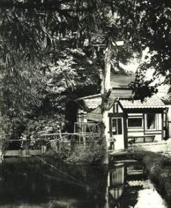Mill and footbridge at bottom of garden