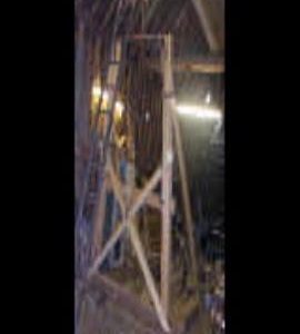 Constructing wooden structure in barn