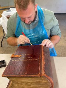 Volunteer at the Mills Archive